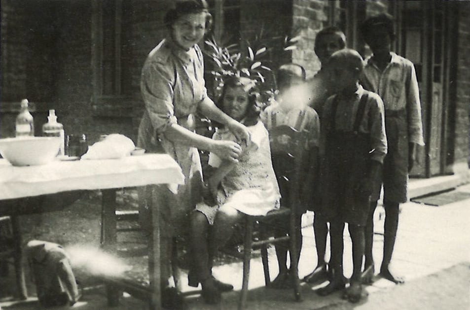Susie giving inoculations to the children of Velestino Village in Greece. 10th September 1945.