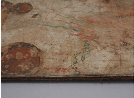 After treatment - if you look closely, below the red wording, you can see the tab of Japanese paper being used to secure the chart to the boards. 