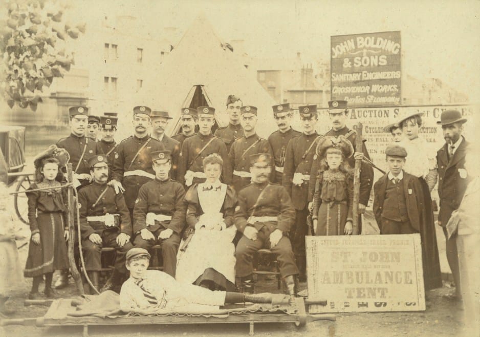 St John Ambulance Brigade members with civilians at a St John Ambulance Brigade first aid tent, c.1890s (Archive ref: A707)