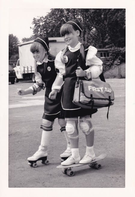 Two St John Ambulance badgers on wheels (skateboard and rollerskates) during Badger Safety Week, 10/07/1989 (Archive ref: PHO4195) 