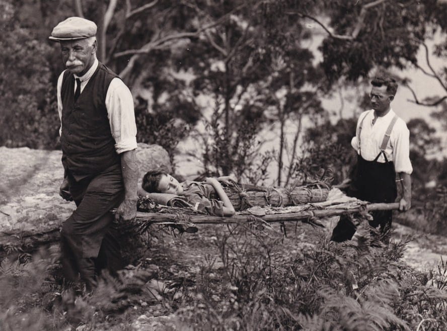 An Instructor from the St John Ambulance Association's New South Wales Centre instructing a in improvised stretchers using a demonstration, 05/03/1933 (Archive ref: PHO4730)